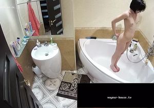 Brunette brushes teeth while BF relaxes in shower