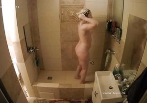 My blonde GF relaxes in shower not knowing about cam