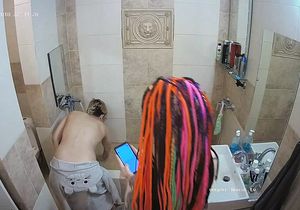 Blonde prepares bathroom for fun with inked friend