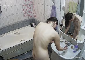 Nude gal checks her ass and pussy solo in bathroom