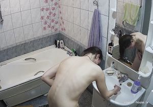 Nude gal checks her ass and pussy solo in bathroom