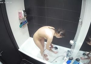 Cute sexpot goes in the shower to relax after work