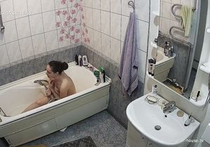 Girl relaxes in bathroom thinking she is alone there