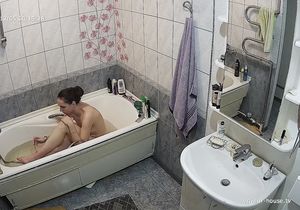 Girl relaxes in bathroom thinking she is alone there