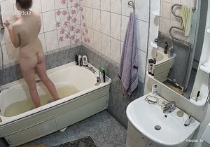 Girl relaxes in bathroom thinking she is alone there