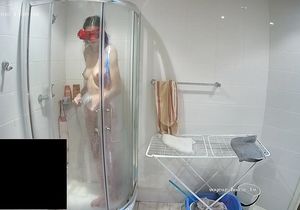 Masked lovers sneak in the shower to prepare for sex