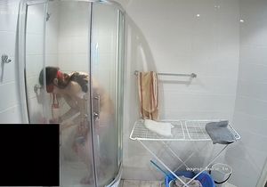 Masked lovers sneak in the shower to prepare for sex
