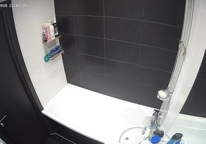 My stepsister takes a shower and exposes her charms