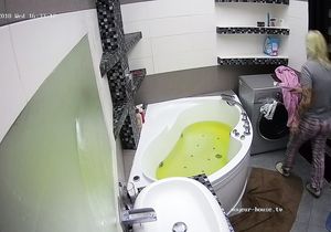 Hidden camera films the blonde in the bathroom