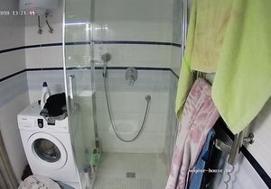Curvy redhead relaxes in shower with slender roommate
