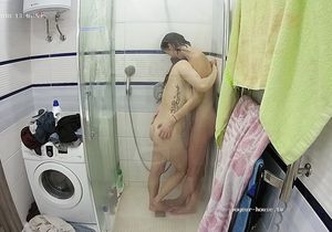 Curvy redhead relaxes in shower with slender roommate