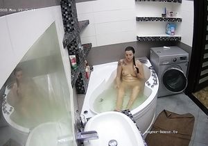 Cutie lies naked in the bathtub while I spy on her
