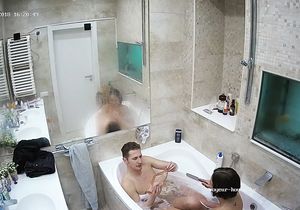 Brunette joins my relaxed roommate in bubble bath