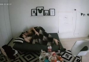 Two young lovers experience sneaky sex on the couch