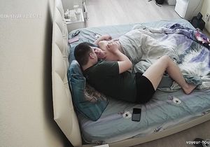 I watch my stepdaughter who lies in bed and touches cock