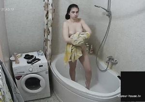 Teen tirelessly washes body and particularly twat