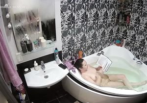 Hidden camera captures naked chick in bathroom