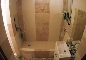 Tattooed girls save water taking shower together