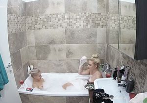 My girlfriend is shaving pussy in the shower room