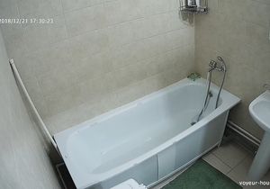 Tattooed brunette takes a bath on my hidden camera