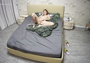 Redhead ostentatiously inserts sex toy in vagina