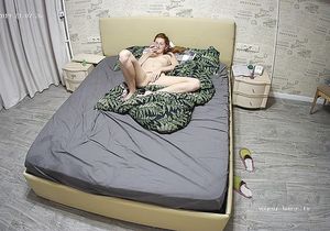 Redhead ostentatiously inserts sex toy in vagina